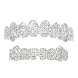 Macro shot of silver hip hop grillz set with sparkling paved cubic zirconia stones