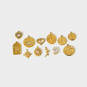 Detailed set of 12 gold-plated stainless steel charms with sun, moon, and heart shapes