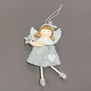 Macro view of plush Christmas angel ornaments with heart details and wings on gray surface
