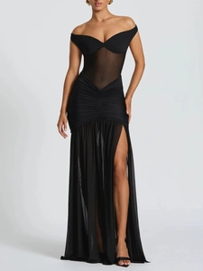 Detail of elegant black off-shoulder maxi dress with sheer mesh waist and high side slit