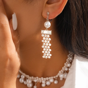 Elegant baroque pearl tassel earrings with rhinestones on model for a vintage look