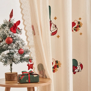 Festive Santa Claus and gift box embroidery on semi-sheer beige Christmas lace curtains