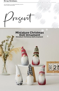 Close-up of five mini Christmas gnomes with knitted hats in a cozy Nordic home setting