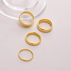 Gold stainless steel rings set in 2mm to 8mm widths with polished minimalist finish