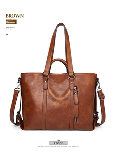 Vista frontale di una borsa tote marrone vintage in pelle cerata con dettagli a zip