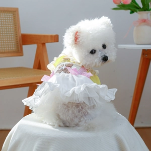 Detail of dog dress with bear embroidery, pink plaid bow and layered white tulle skirt