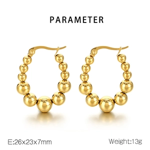 Detailed view of U-shaped gold bead earrings with size specifications and weight