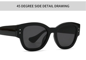 45-degree side view of oval black marble sunglasses featuring metal rivet details