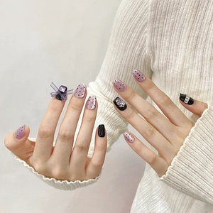 Handmade light purple cat-eye press-on nails with 3D bows and sparkling diamond accents