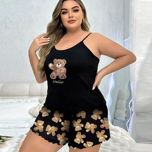Detail of plus size black pajamas set featuring bear print and delicate ruffle trim