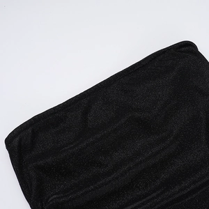 Detail shot of shimmering black sequin fabric texture for this elegant cocktail dress