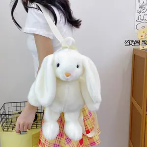 Close-up of a white plush bunny backpack with soft faux fur and adjustable straps