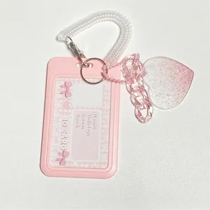 Pink heart glitter ID card holder with spring coil keychain and decorative charms