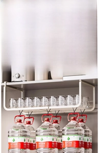 Detail of solid carbon steel under-cabinet basket showing strong weight-bearing capacity