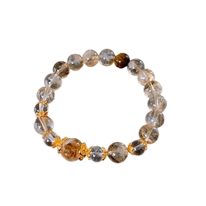 Golden Citrine and Tiger Eye beaded bracelet with metallic petal spacers on white background
