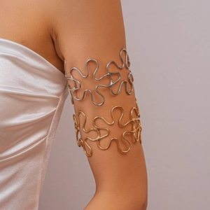 Detailed view of hollow wave pattern arm cuffs in gold and silver finish for upper arm