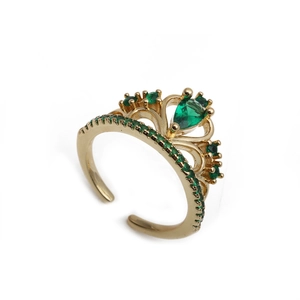 Adjustable golden crown ring with green zircon stones in a minimalist open design