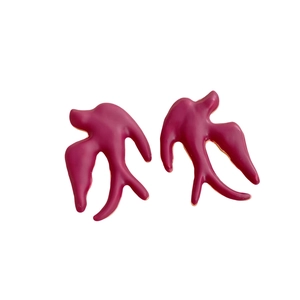 Minimalist dark pink swallow bird stud earrings with a glossy spray paint finish