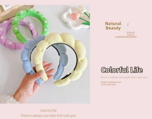 Detail of colorful plush bubble headbands with white faux pearls and non-slip inner teeth
