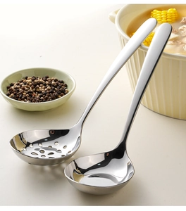 Close-up of polished 304 stainless steel soup ladle and slotted spoon set in a kitchen setting