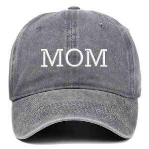 Close-up of white MOM embroidery on washed dark gray cotton baseball cap with fabric texture