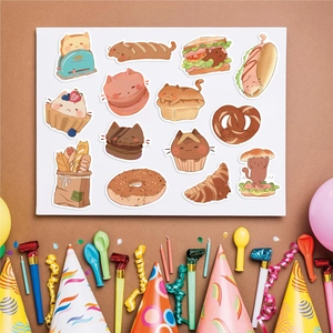 Close-up of cute cartoon cat stickers with baking themes and festive party decorations