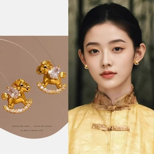 24k gold plated rocking horse earrings featuring zircon inlay and model style view