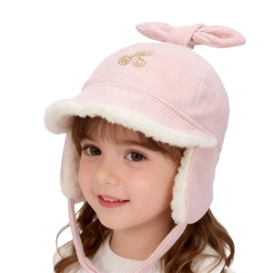 Pink corduroy winter earflap hat for kids with plush lining and bow decoration