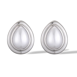 Macro detail of silver drop-shaped earrings with a polished double-layer 3D design