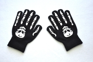 Detailed knit of skeleton bone prints on black fingerless gloves for Halloween themed biking