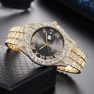 Macro shot of GANWA luxury gold quartz watch showing date window and crystal details