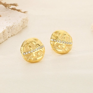 Textured round gold earrings with sparkling crystal accents in a stylish circular design