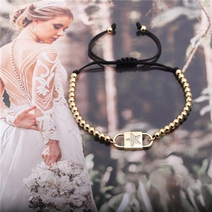 Bracelet ajustable en corde noire avec perles dorées et breloque étoile en zircon