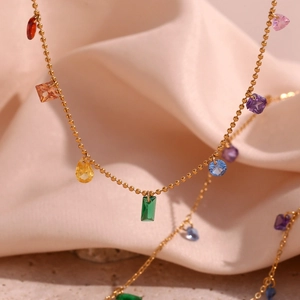 Detailed close-up of 18K gold plated beaded chain with vibrant multi-colored zircons