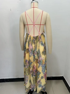 Close-up of yellow floral chiffon dress featuring cross-back straps and open back detail