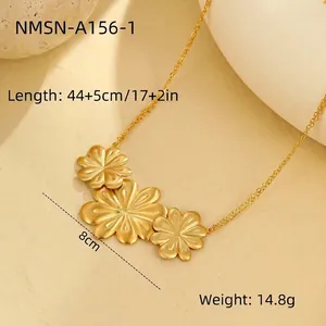 Detailed view of brushed gold triple flower pendant necklace with size measurements