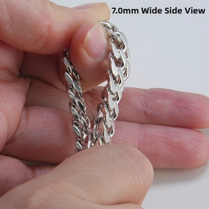 Detailed side view of 7.0mm wide sterling silver Cuban link chain with polished finish