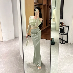 Detailed view of sage green off-shoulder long sleeve top and slim fit maxi skirt