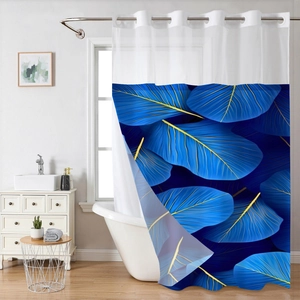 Detail of waffle weave shower curtain with blue leaf pattern and metal hanging rings
