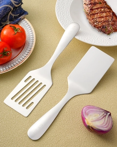 Close-up of SUS 304 stainless steel spatula set with solid and slotted turner blades