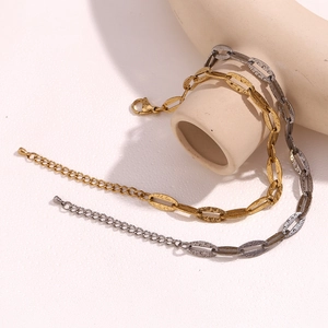 Detail of 14K gold and silver chunky oval link chains with lobster clasp and extension