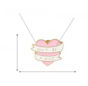 Pink heart enamel pin with 'DON'T BE A DICK' text, zinc alloy material and size details