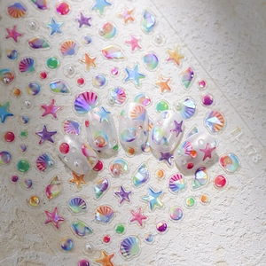 3D holographic ocean nail stickers with embossed shells and starfish design on stone surface