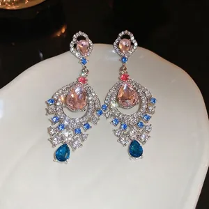 Vintage palace style teardrop earrings with pink, blue, and white crystals in silver