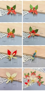 Detail of Christmas cake toppers featuring miniature wreaths, bells and holiday ornaments