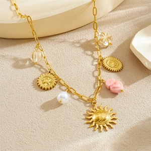 Gold stainless steel sun and moon necklace with pearls and pink heart pendant