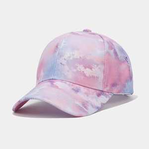 Close-up of pink and blue tie-dye pattern on cotton twill baseball cap fabric texture