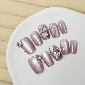 Handmade purple cat eye press-on nails set with luxury rhinestones and metallic beads