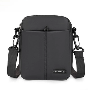 Detail of waterproof nylon crossbody bag featuring DIEKE logo and adjustable strap
