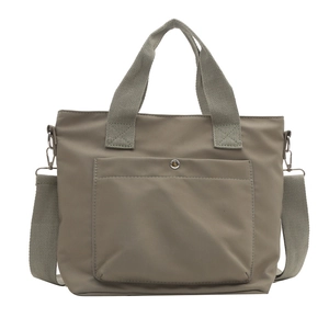 Khaki nylon bucket tote bag with front snap pocket and adjustable crossbody strap